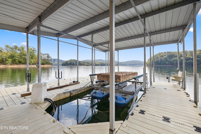 view of dock with a water view