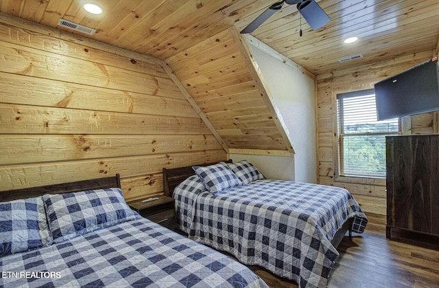 bedroom with ceiling fan, wooden walls, wooden ceiling, vaulted ceiling, and dark hardwood / wood-style flooring