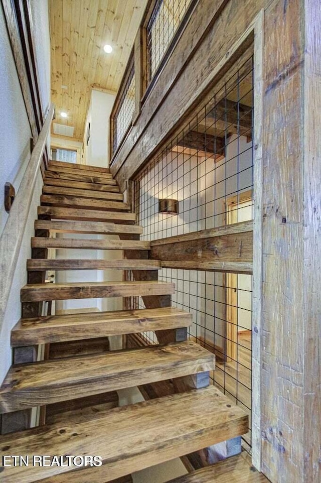 staircase featuring hardwood / wood-style floors
