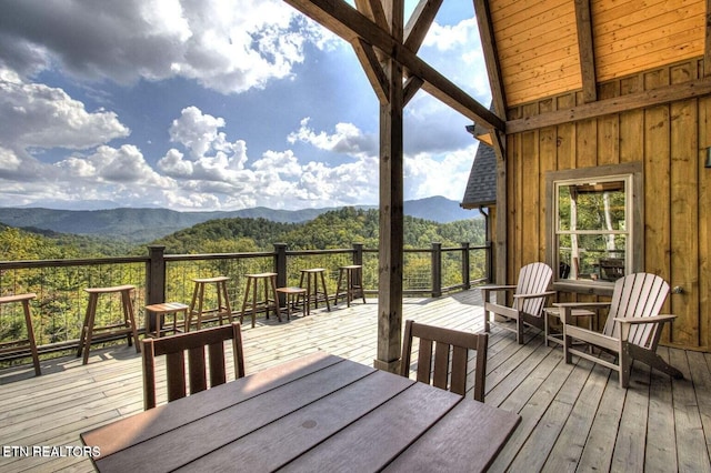 wooden deck featuring a mountain view