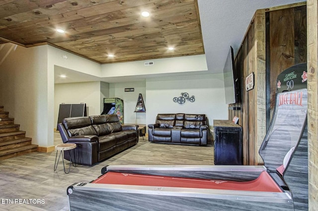 living room featuring wood ceiling and hardwood / wood-style floors
