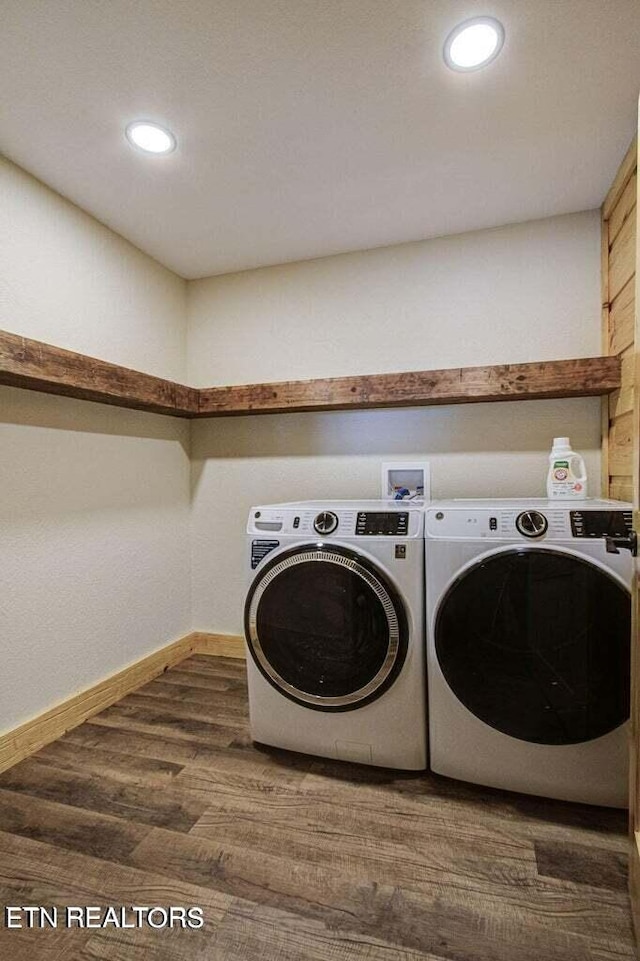 clothes washing area with independent washer and dryer and dark hardwood / wood-style floors