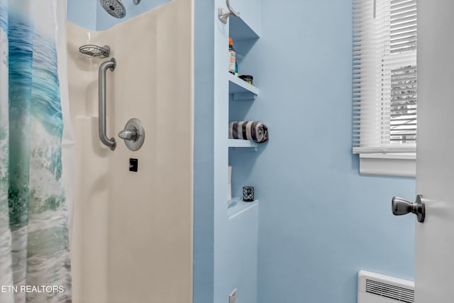 bathroom featuring a shower with curtain