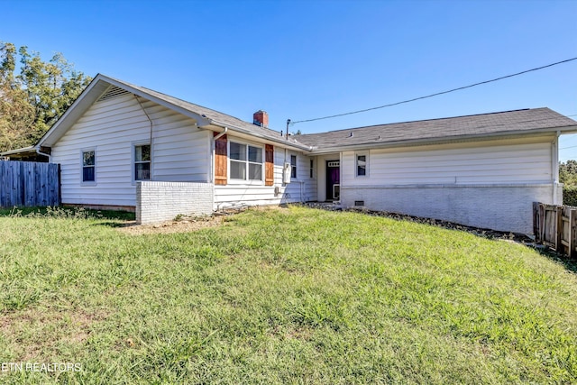 ranch-style home with a front yard