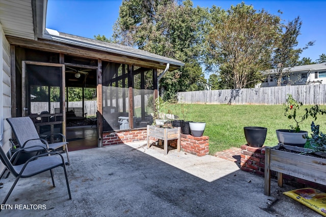 view of patio / terrace with a sunroom