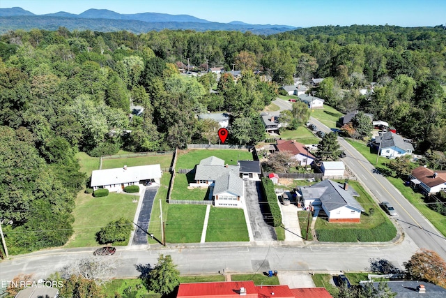 birds eye view of property with a mountain view