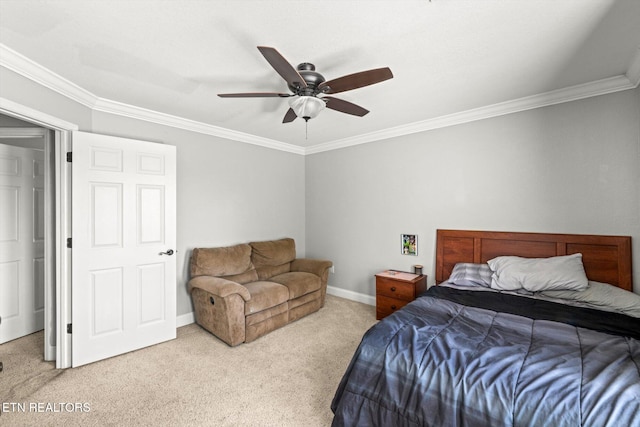 bedroom with ceiling fan, ornamental molding, and carpet