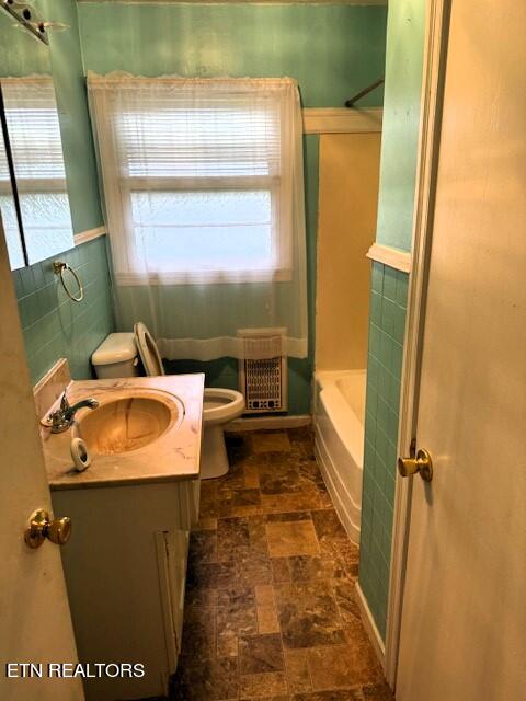 full bathroom featuring vanity, toilet, and tub / shower combination