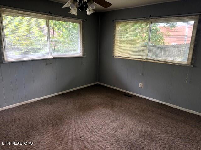 carpeted empty room with ceiling fan