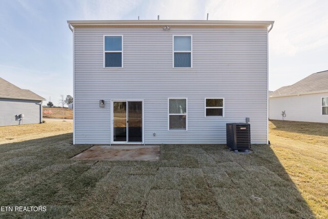 7821 Night Shade Ln, Knoxville, TN 37938 - rear view of house featuring central AC, a patio, and a lawn
