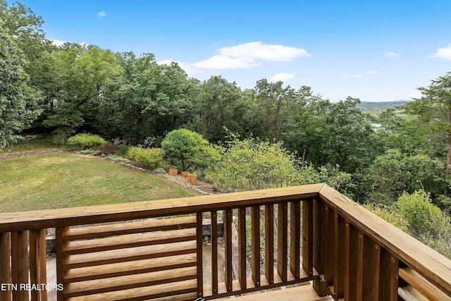 deck featuring a lawn