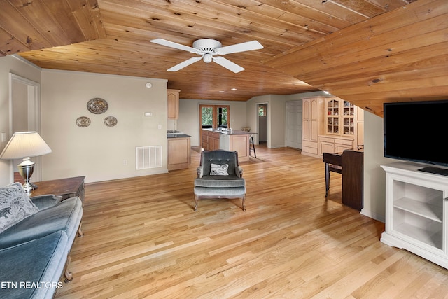 living room with light hardwood / wood-style flooring, vaulted ceiling, ceiling fan, and wooden ceiling