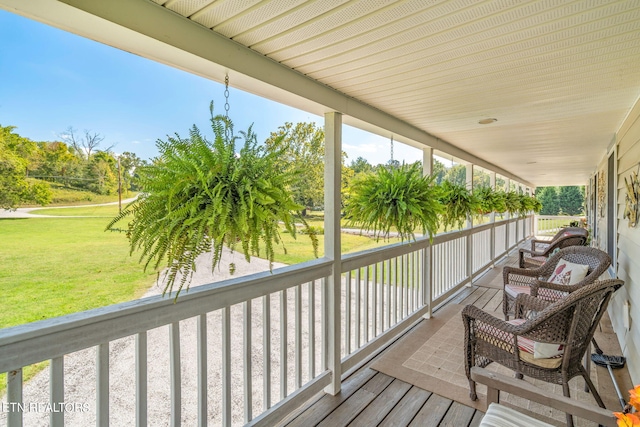 wooden deck with a yard