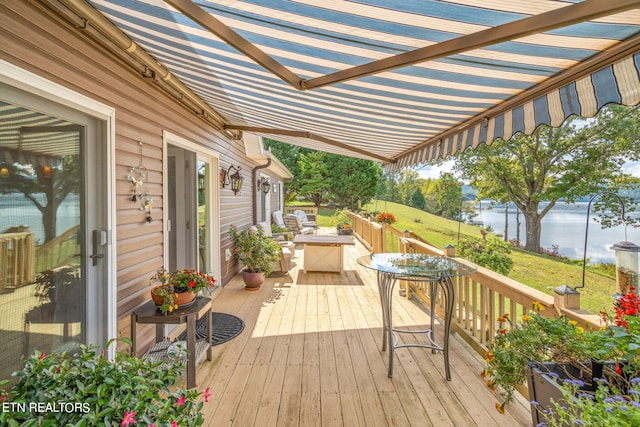 wooden deck with a water view