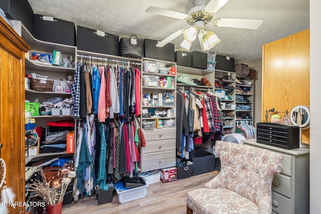 spacious closet with wood-type flooring and ceiling fan