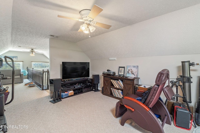 home office featuring ceiling fan, a textured ceiling, and vaulted ceiling