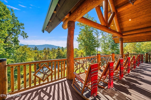 wooden terrace with a mountain view