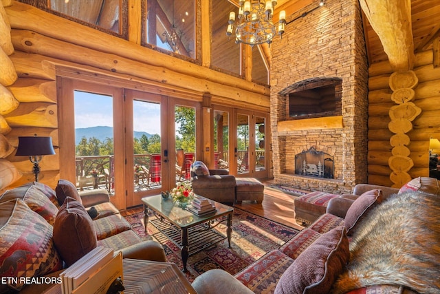 living room with hardwood / wood-style flooring, beamed ceiling, high vaulted ceiling, a fireplace, and french doors