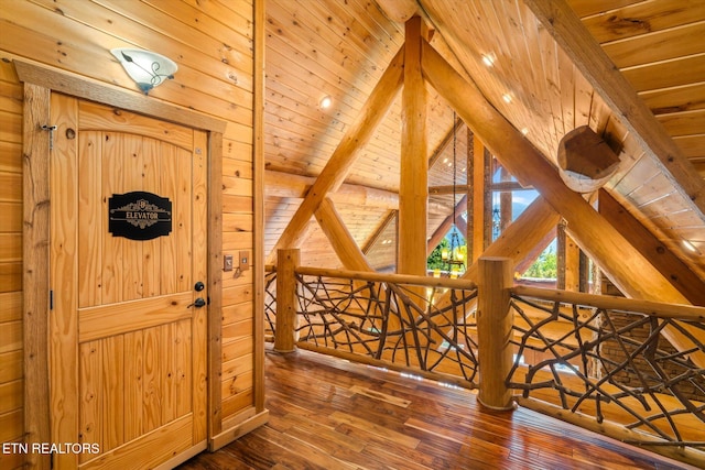 hall featuring dark hardwood / wood-style flooring and wooden ceiling