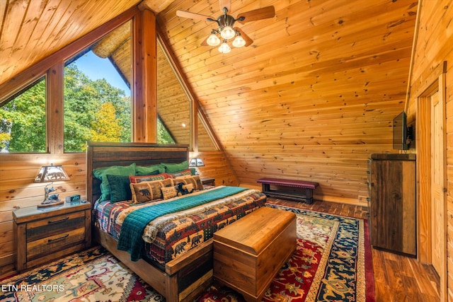 bedroom with wood walls, wood ceiling, wood-type flooring, and vaulted ceiling