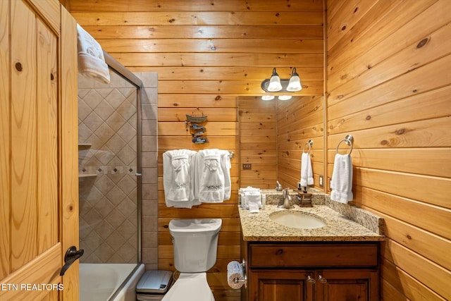 full bathroom featuring wood walls, vanity, toilet, and plus walk in shower