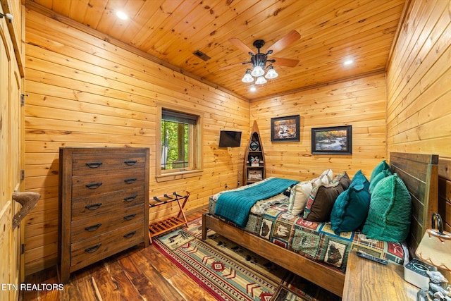 bedroom with wood-type flooring, wooden walls, ceiling fan, and wooden ceiling