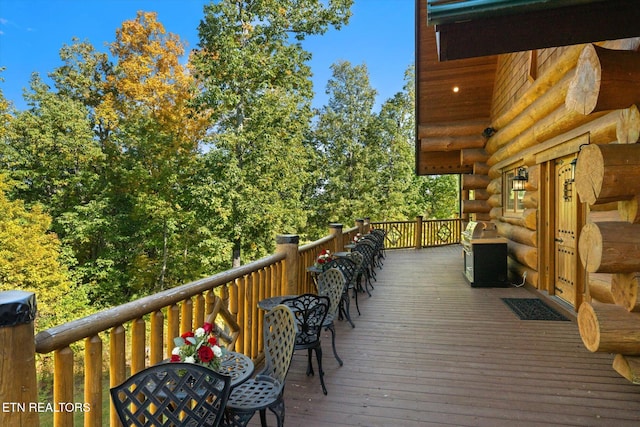 wooden deck featuring area for grilling