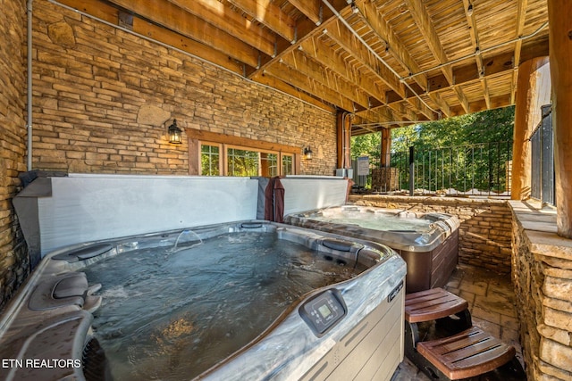 view of patio / terrace featuring a hot tub