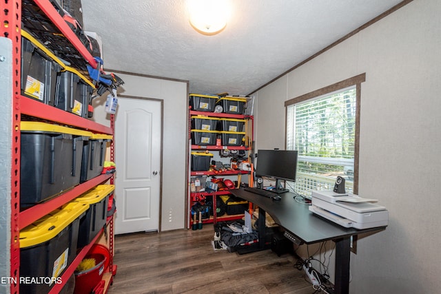 office area with ornamental molding, a textured ceiling, and dark hardwood / wood-style flooring