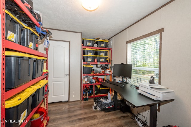 office area featuring dark hardwood / wood-style floors, ornamental molding, and a textured ceiling