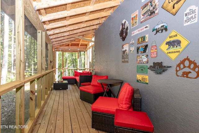 sunroom featuring lofted ceiling