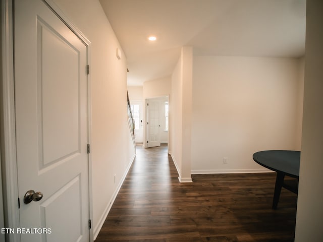 hall with dark hardwood / wood-style floors