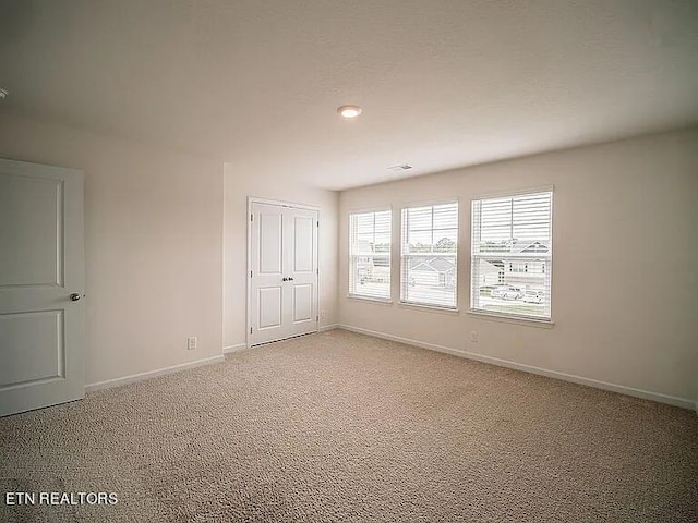 empty room featuring carpet flooring