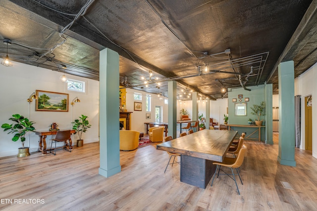 dining area with wood-type flooring