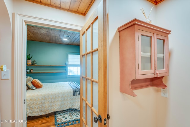 bedroom featuring wood ceiling and hardwood / wood-style flooring