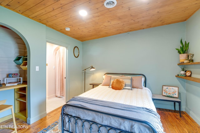 bedroom featuring wooden ceiling and light hardwood / wood-style flooring