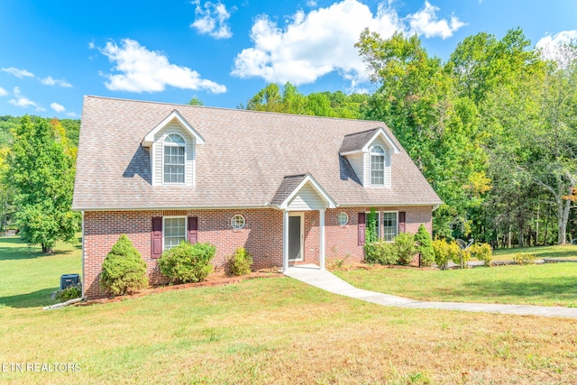 new england style home featuring a front lawn