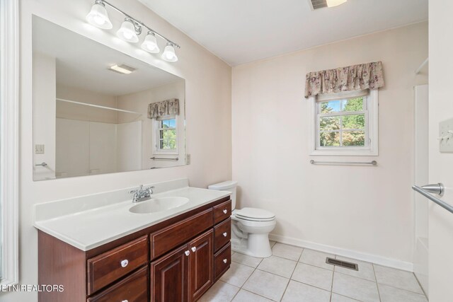 full bathroom featuring shower / tub combination, vanity, tile patterned flooring, and toilet