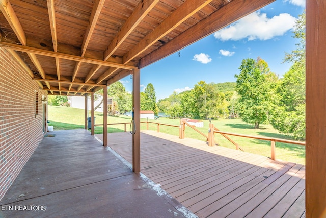 wooden deck with a yard