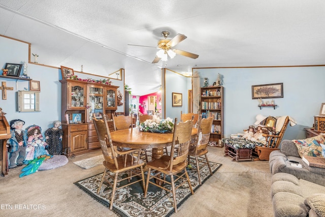 dining area with a textured ceiling, lofted ceiling, light carpet, and ceiling fan