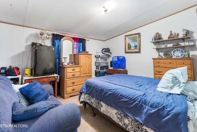 carpeted bedroom featuring ornamental molding, lofted ceiling, and a textured ceiling