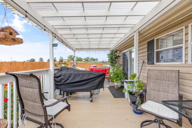 deck featuring area for grilling and a pergola