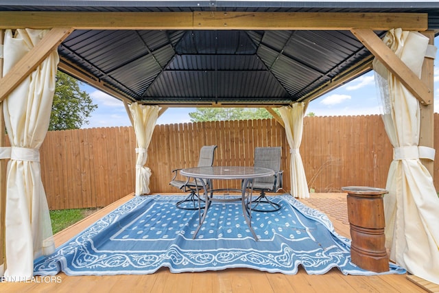 view of patio featuring a deck and a gazebo