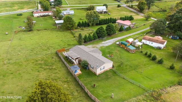 birds eye view of property with a rural view