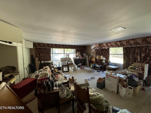 misc room with carpet floors and a healthy amount of sunlight