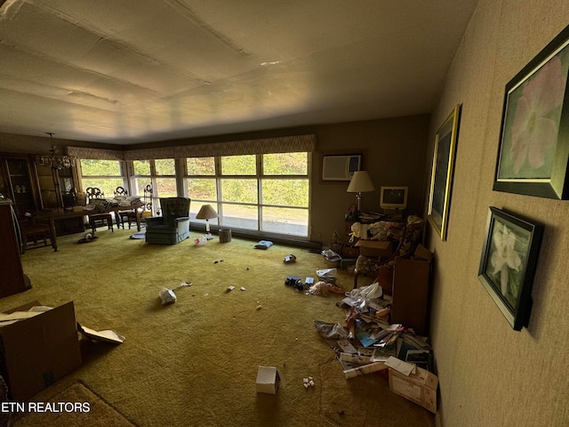 misc room featuring carpet, a wall mounted AC, and a notable chandelier