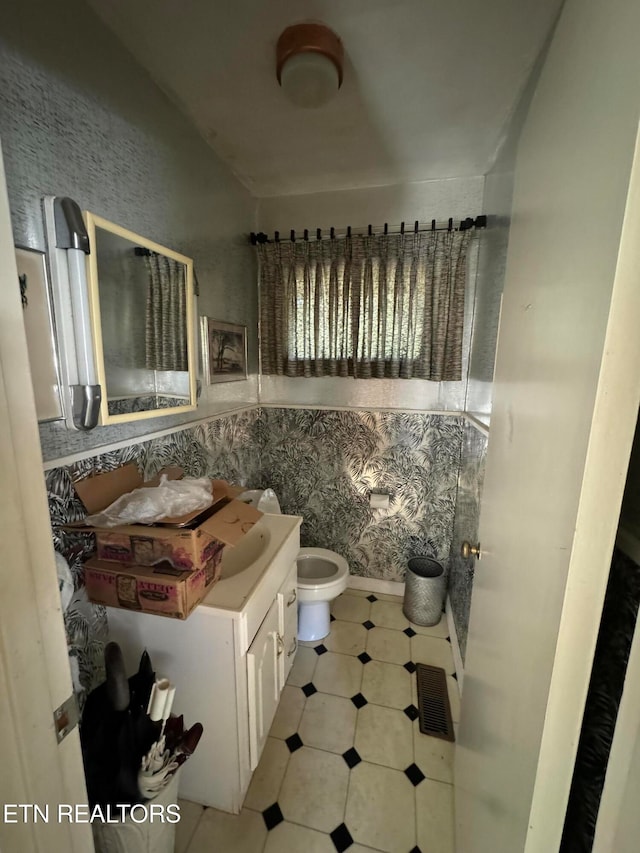 bathroom with vanity and toilet