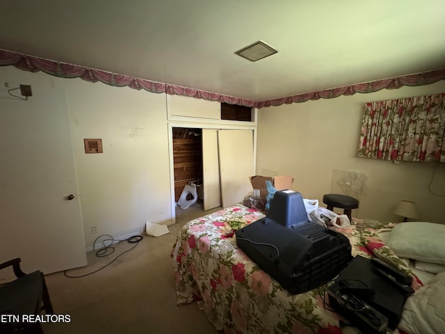 bedroom with carpet floors and a closet