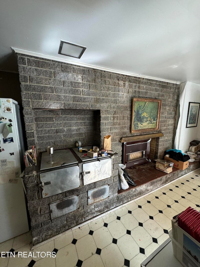 interior space featuring a fireplace and white fridge