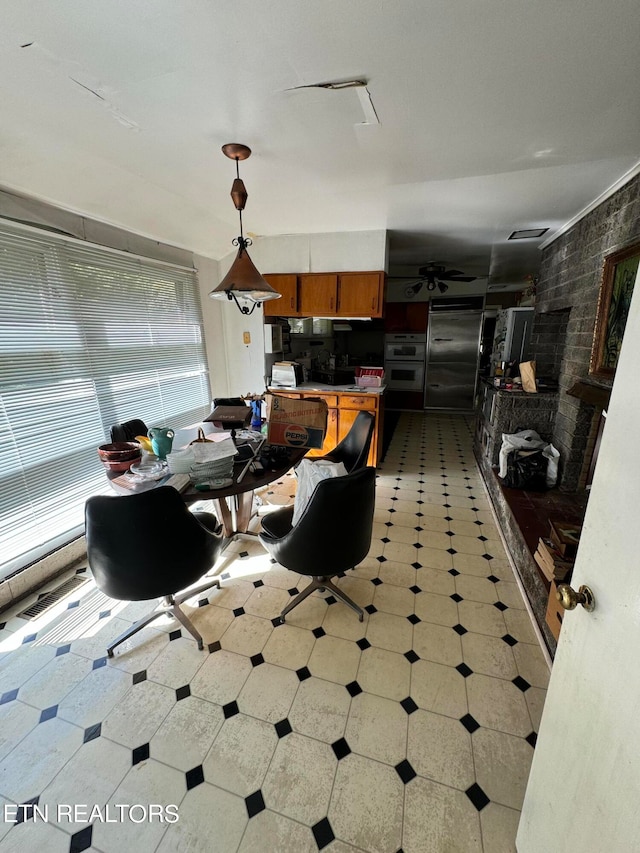 dining space with brick wall